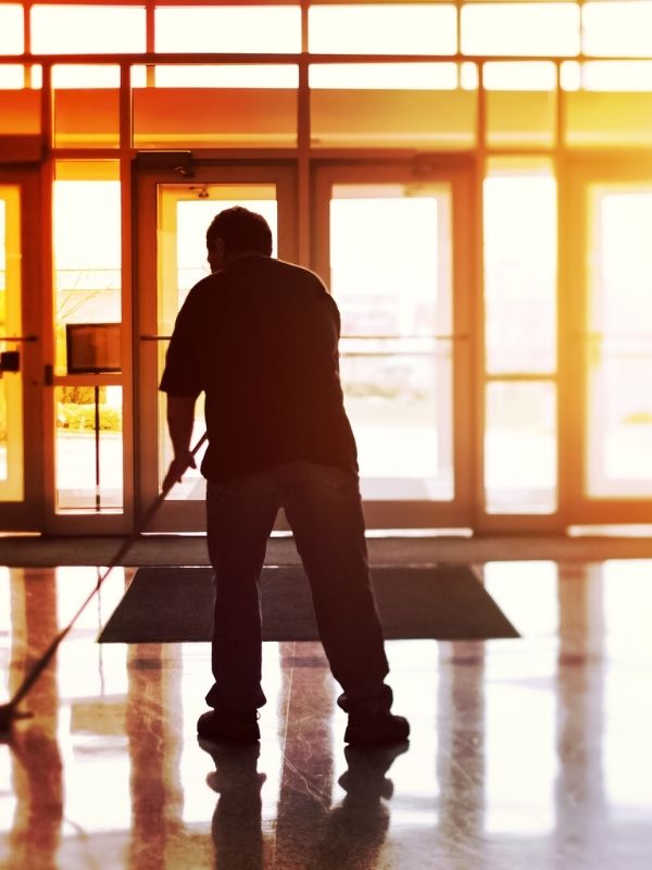 A man mopping the floor